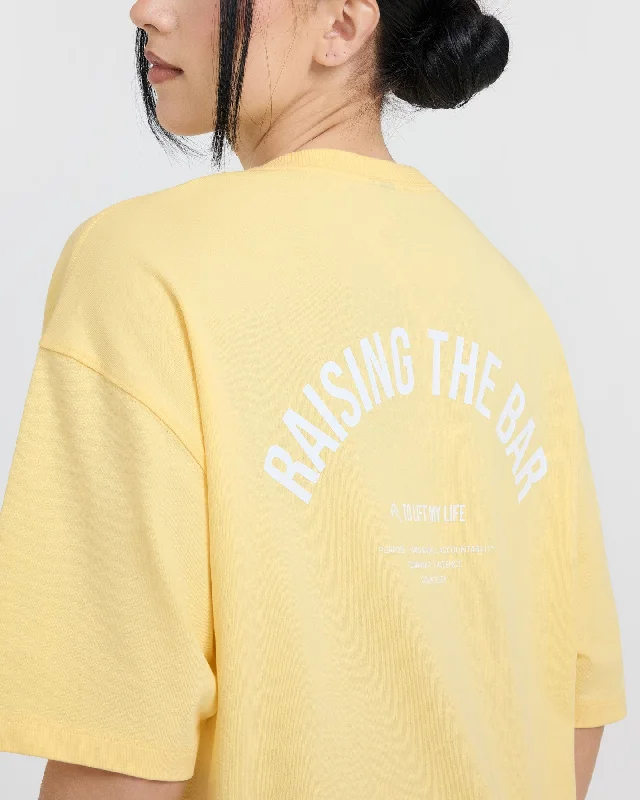 Raising The Bar Graphic Unisex T-Shirt | Sherbert Yellow